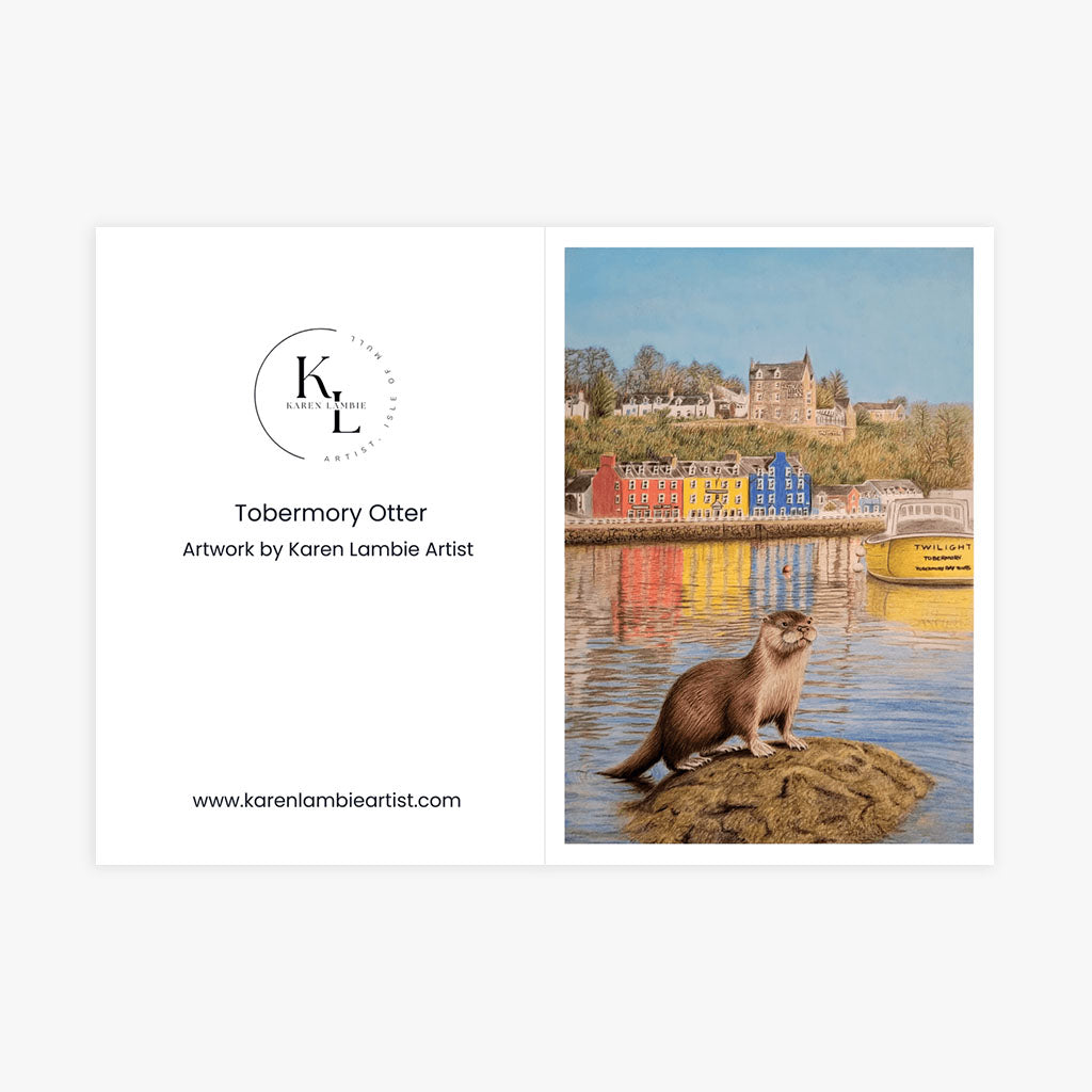 A6 Greetings Card Vertical with Envelope - Scottish coastal scene featuring an otter in the foreground and Tobermory's distinctive architecture with castle on hillside, demonstrating the card's folded size and included white envelope